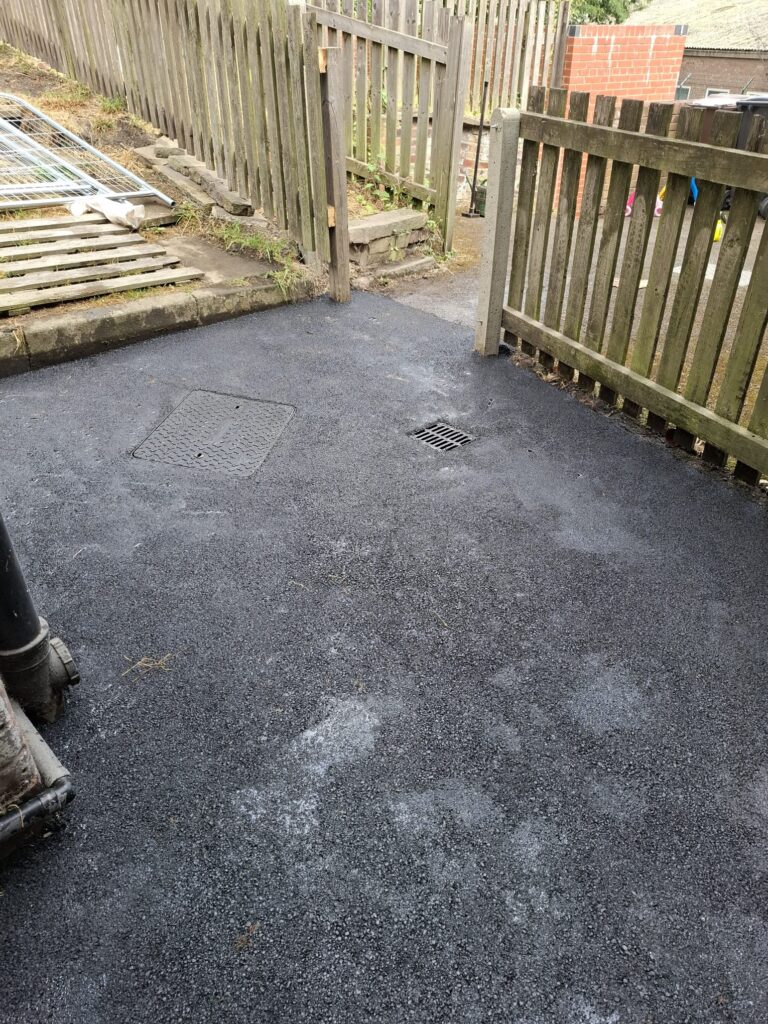 Excavation of heavily degraded surfacing to back yard, installation of new manhole covers and gulleys,
Installation of new surfacing works in Sheffield.