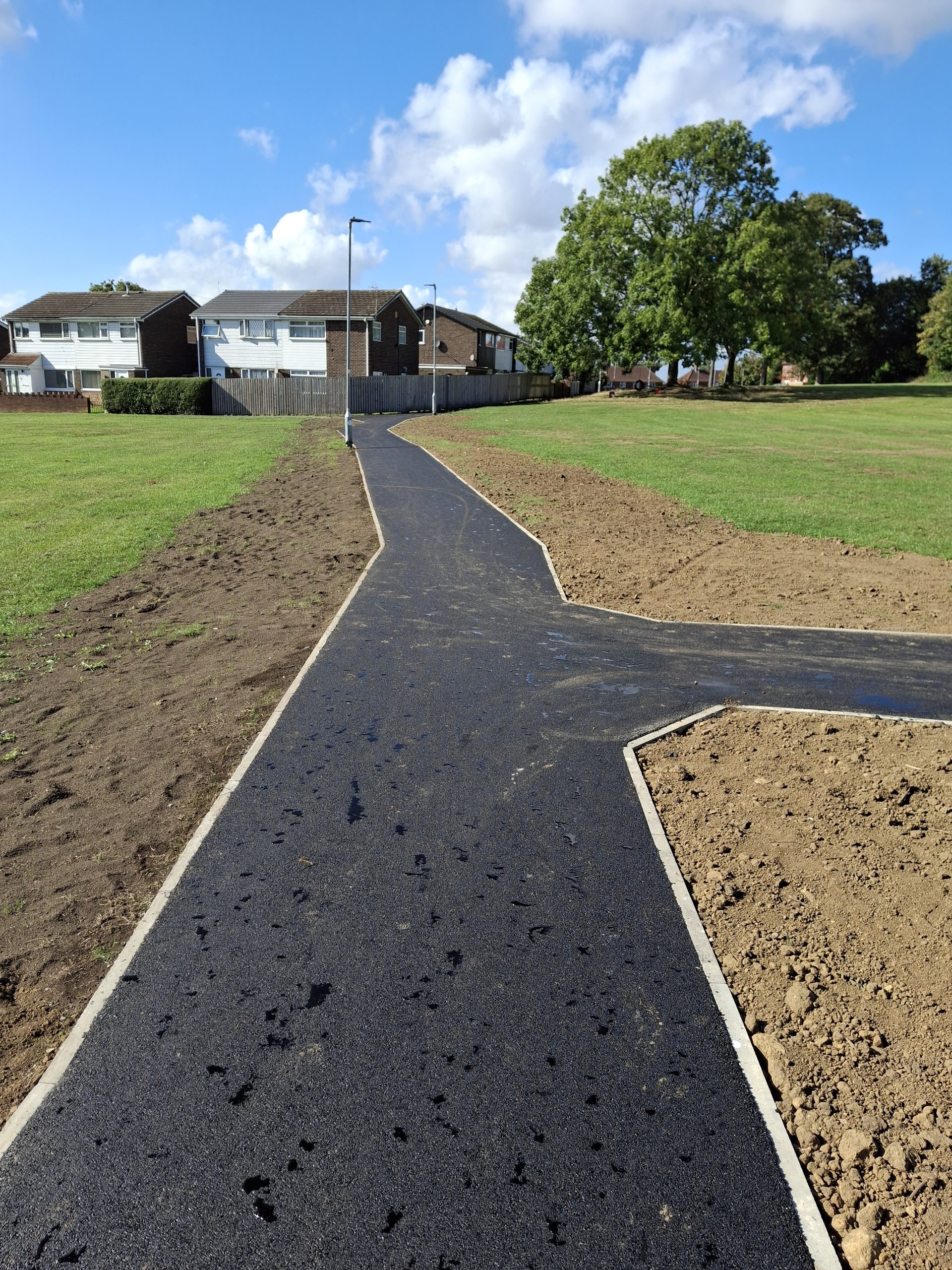 Tarmac surfacing to path across field in Leeds